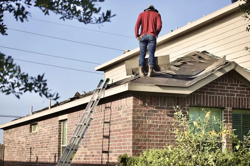 Professional roofer working on a residential roof in Serene